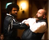 Othello in black leather grabs Iago by the throat