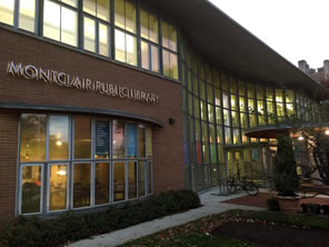 Photo of Montclair Library's entrance at dusk