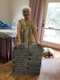 Photo of Maxine Lain holding her tabled of Ten Commandments